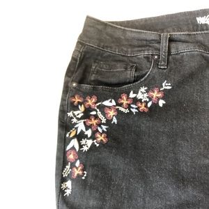 Black flower embroidered jeans.